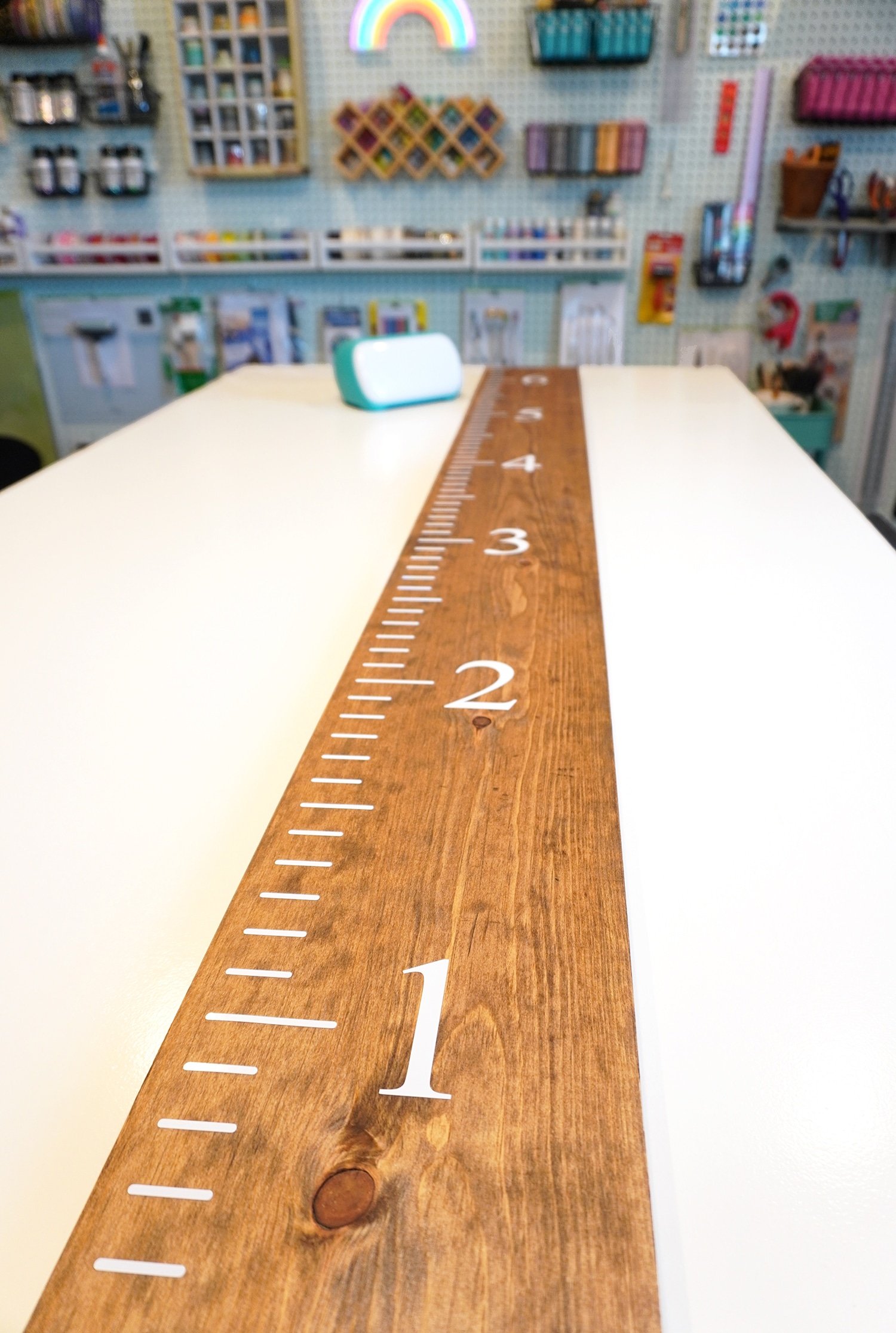 finished DIY growth chart made into shape of giant wooden ruler