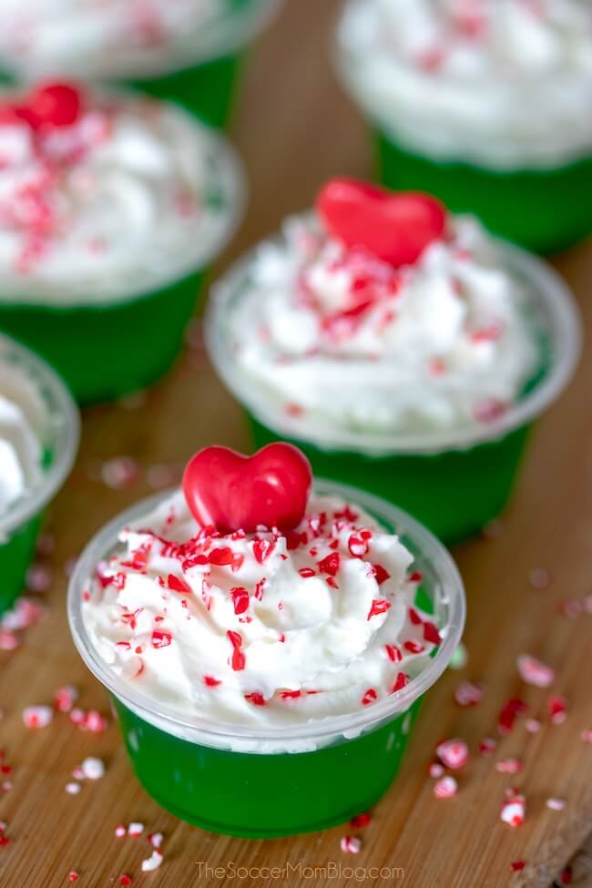 grinch jello shots with whipped cream and red heart