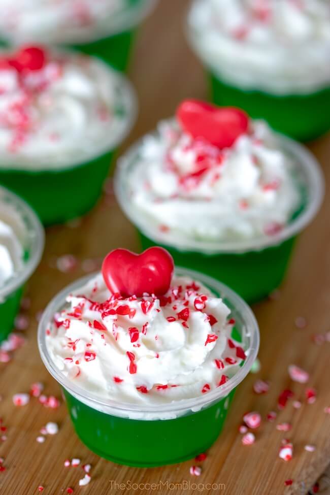 grinch jello shots with whipped cream and red heart