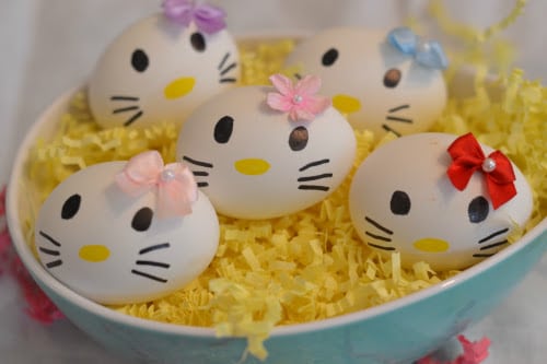 hello kitty faces on easter eggs in bowl