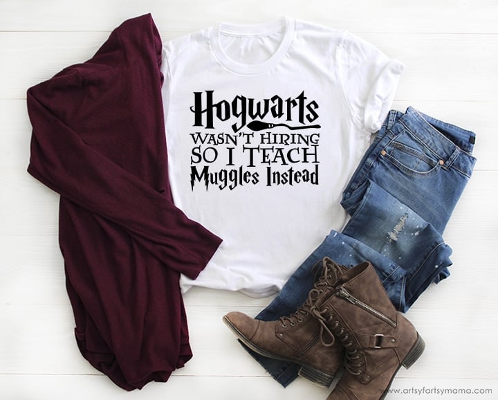 "Hogwarts wasn't hiring so I teach muggles instead" on plain white tee shirt 