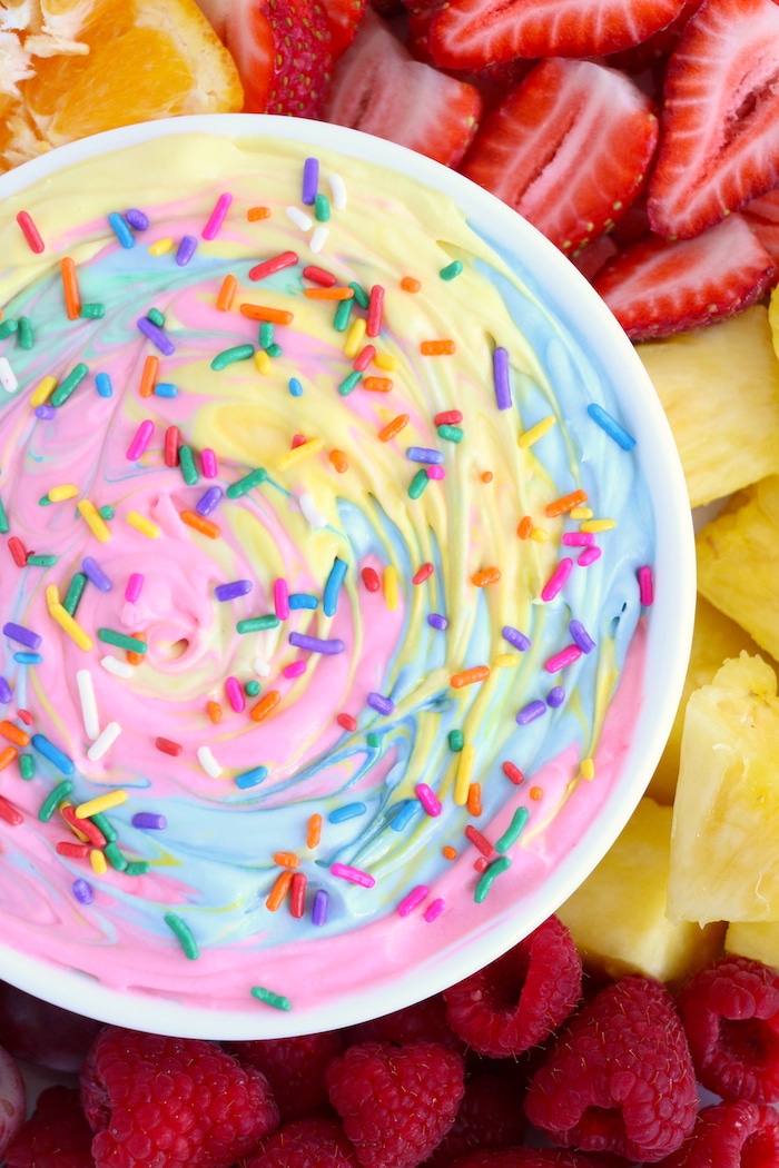 rainbow colored fruit dip with sprinkles