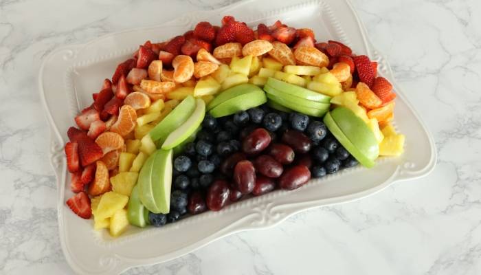 fruit arranged in rainbow colors