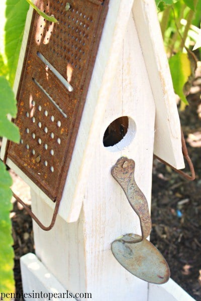 scrap wood and metals made into birdhouse