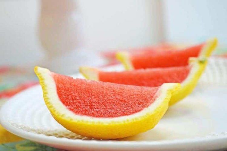 strawberry lemonade jello shot in lemon slice