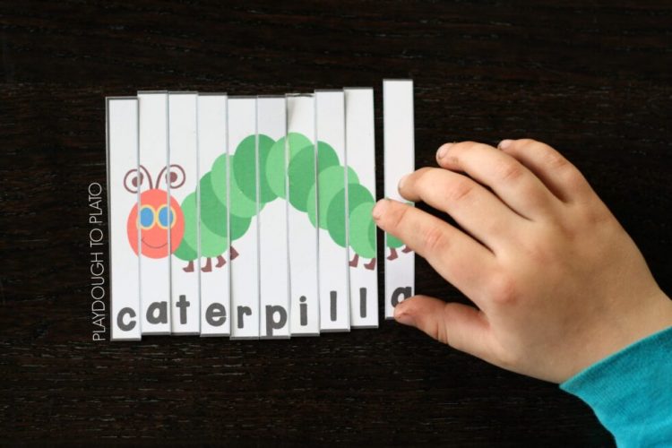 hand playing with caterpillar puzzle