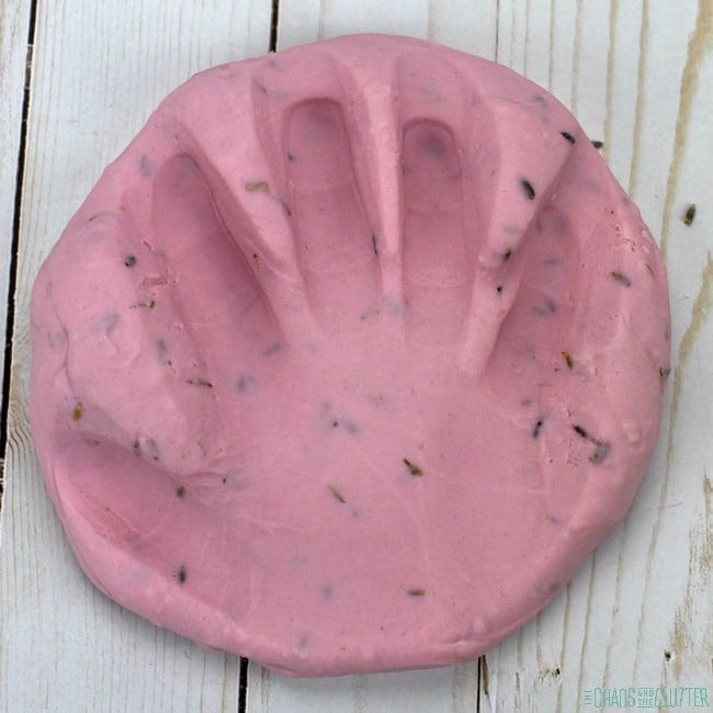 calming lavender scented playdough with hand print squished into it