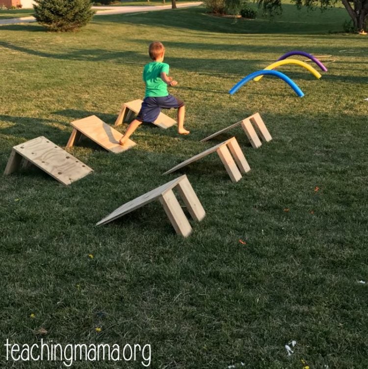floating steps obstacle course in backyard with kid running it