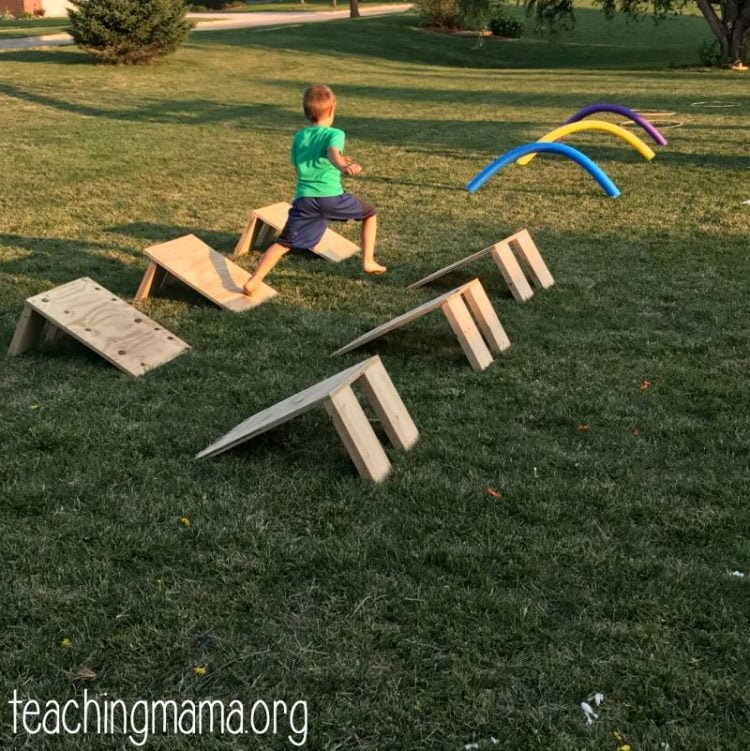 floating steps obstacle course in backyard with kid running it