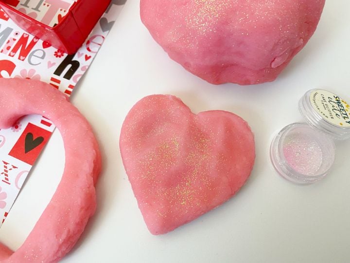 strawberries and cream playdough shaped into a heart 