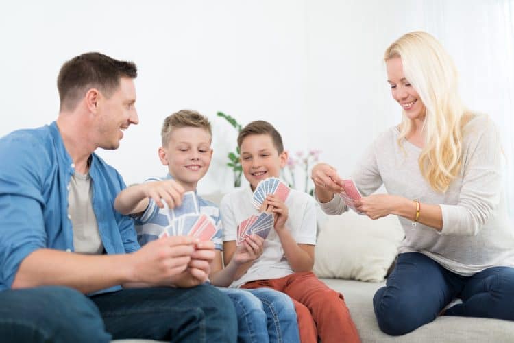 family playing card games together