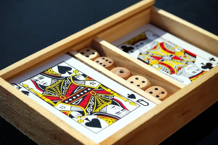 deck of cards and dice in an organizer