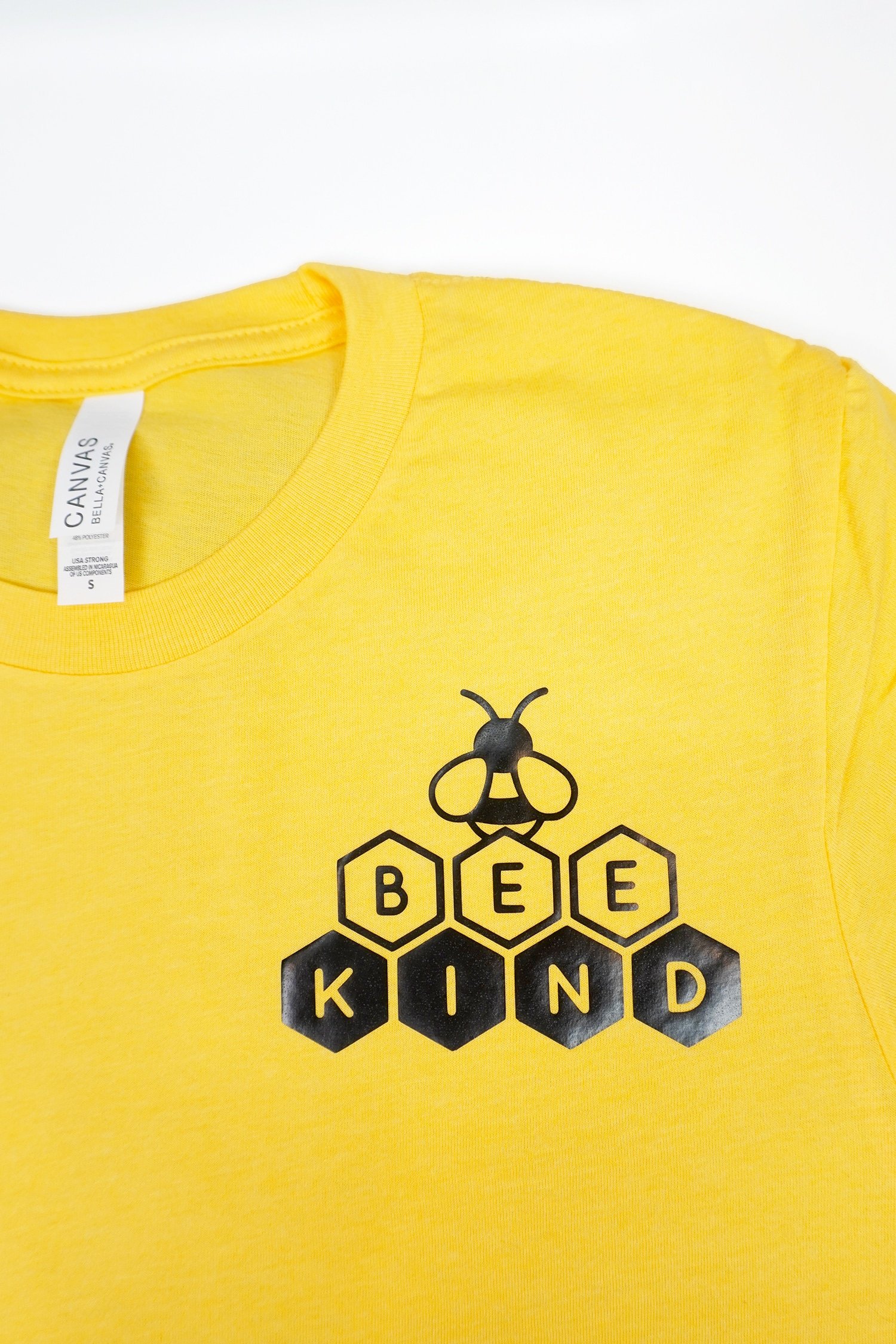 final Bee Kind svg file on yellow shirt