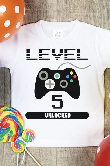 level 5 gaming svg file on tshirt with candy and balloons