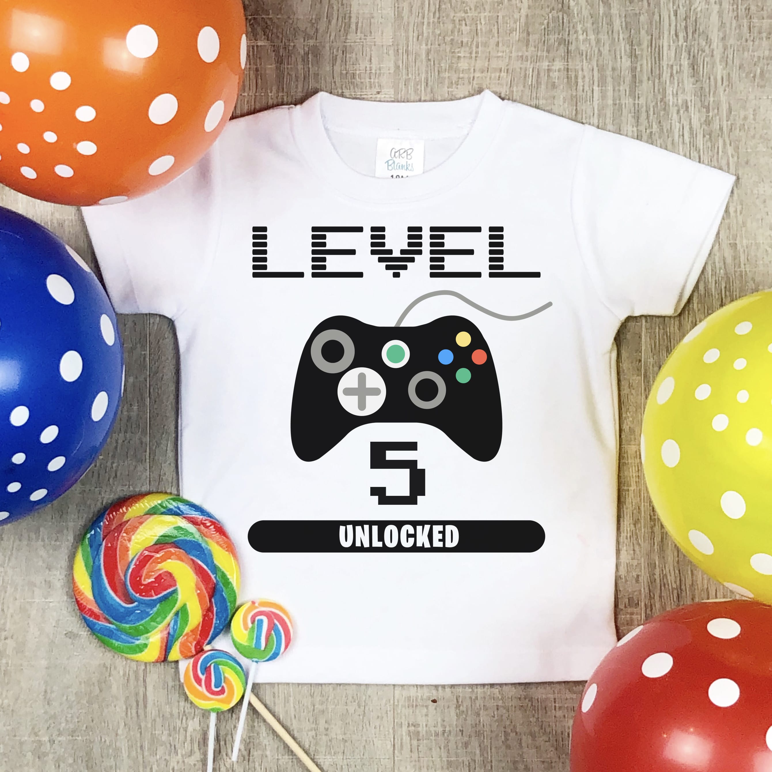 level 5 gaming svg file on tshirt with candy and balloons