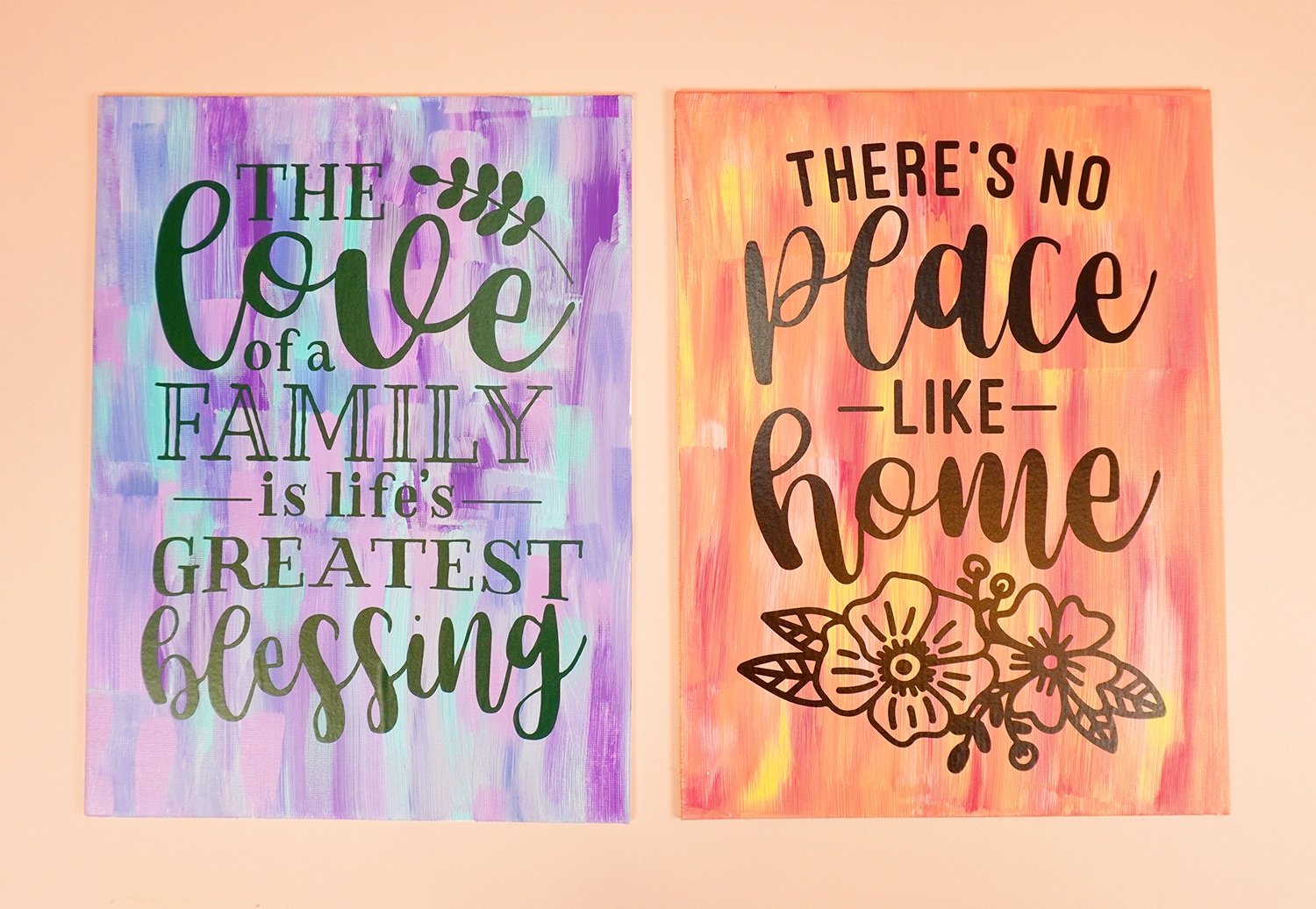 Two "hot mess" painted canvases with vinyl quotes on them