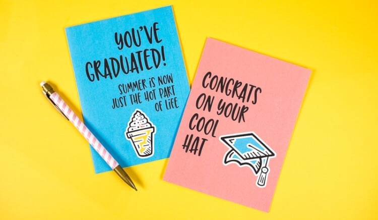 two congratulations cards on a yellow background with a pen