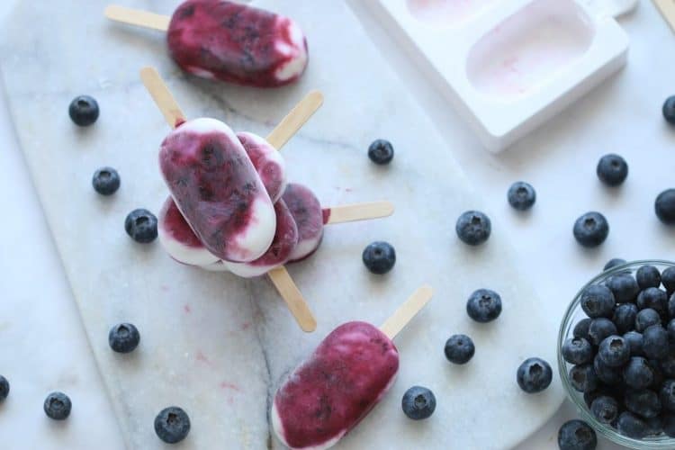 blueberry yogurt popsicles with blueberries