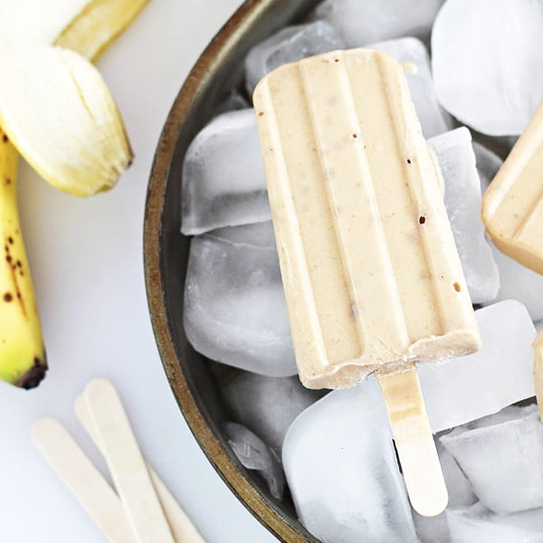 peanut butter banana yogurt pops on ice with banana