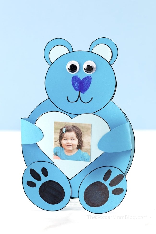 blue bear holding a heart with childs photo