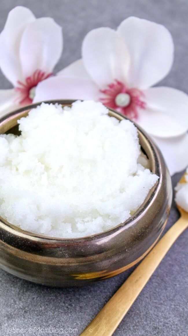 A close up of a jar of cotton blossom sugar scrub