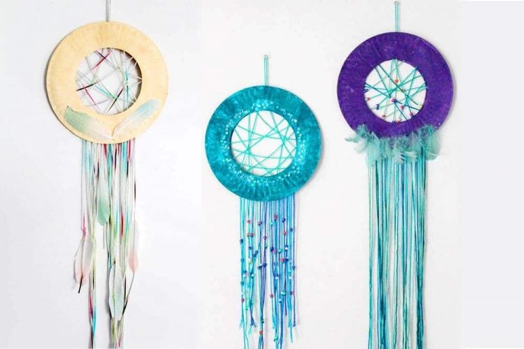 paper plate dream catcher crafts hung on wall