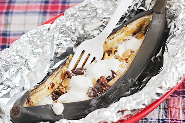 grilled banana dessert with fork and foil
