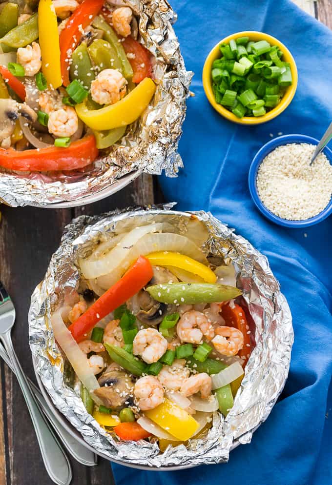 grilled sesame shrimp and veggies on foil platter