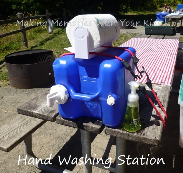 Homemade hand washing station with hand soap and paper towels.