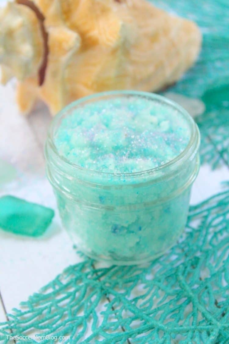 Jar of glittery aqua sugar scrub