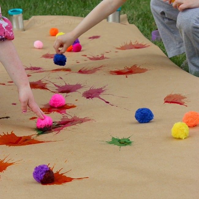 Splatters painted on large craft paper using pom-poms