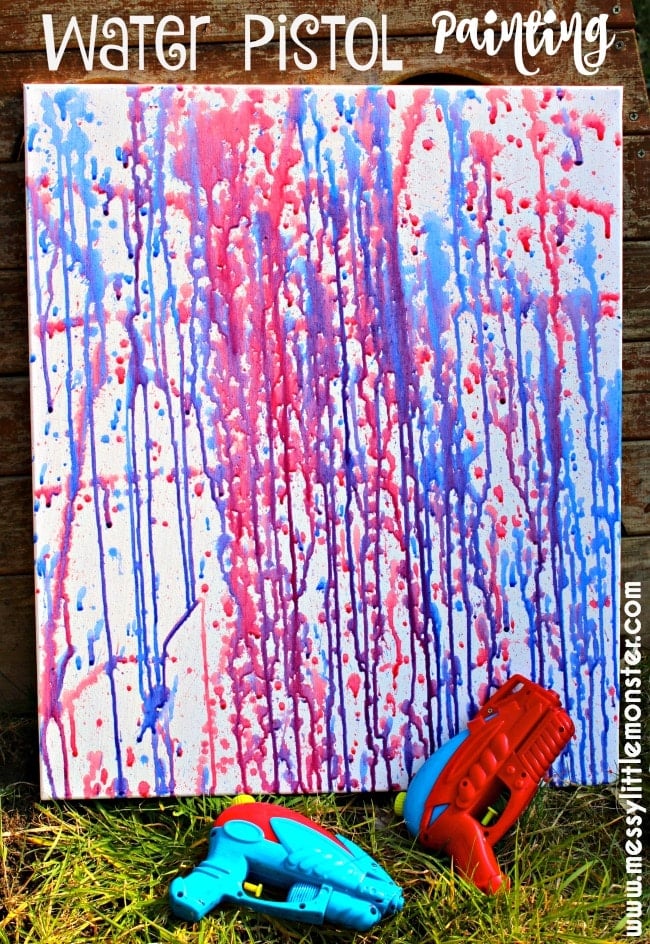 watercolor painting on canvas with water pistols on ground