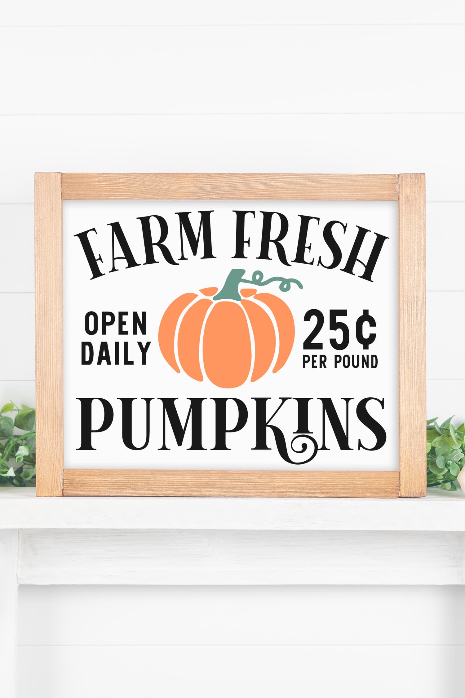 "Farm Fresh Pumpkins" sign with wood frame on white mantel