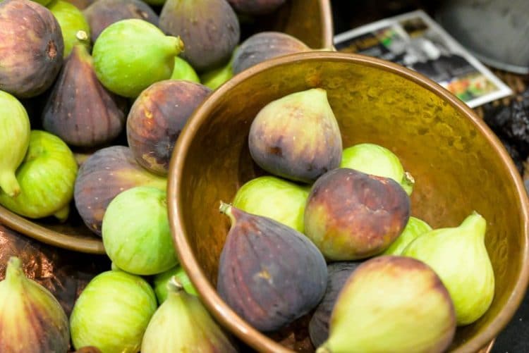 figs in basket being picked