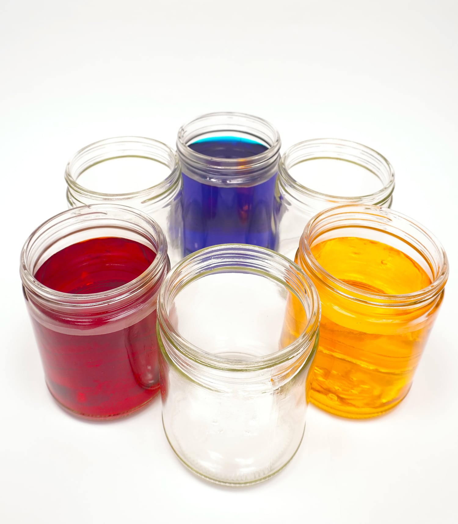 colored jars filled with water in circle of jars