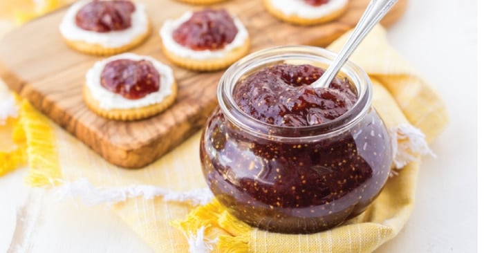 fig jam in container and on crackers