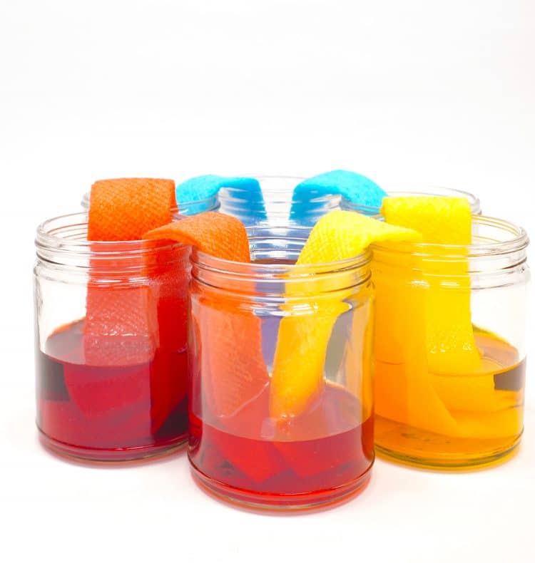 mixed color activity walking rainbow being done in jars
