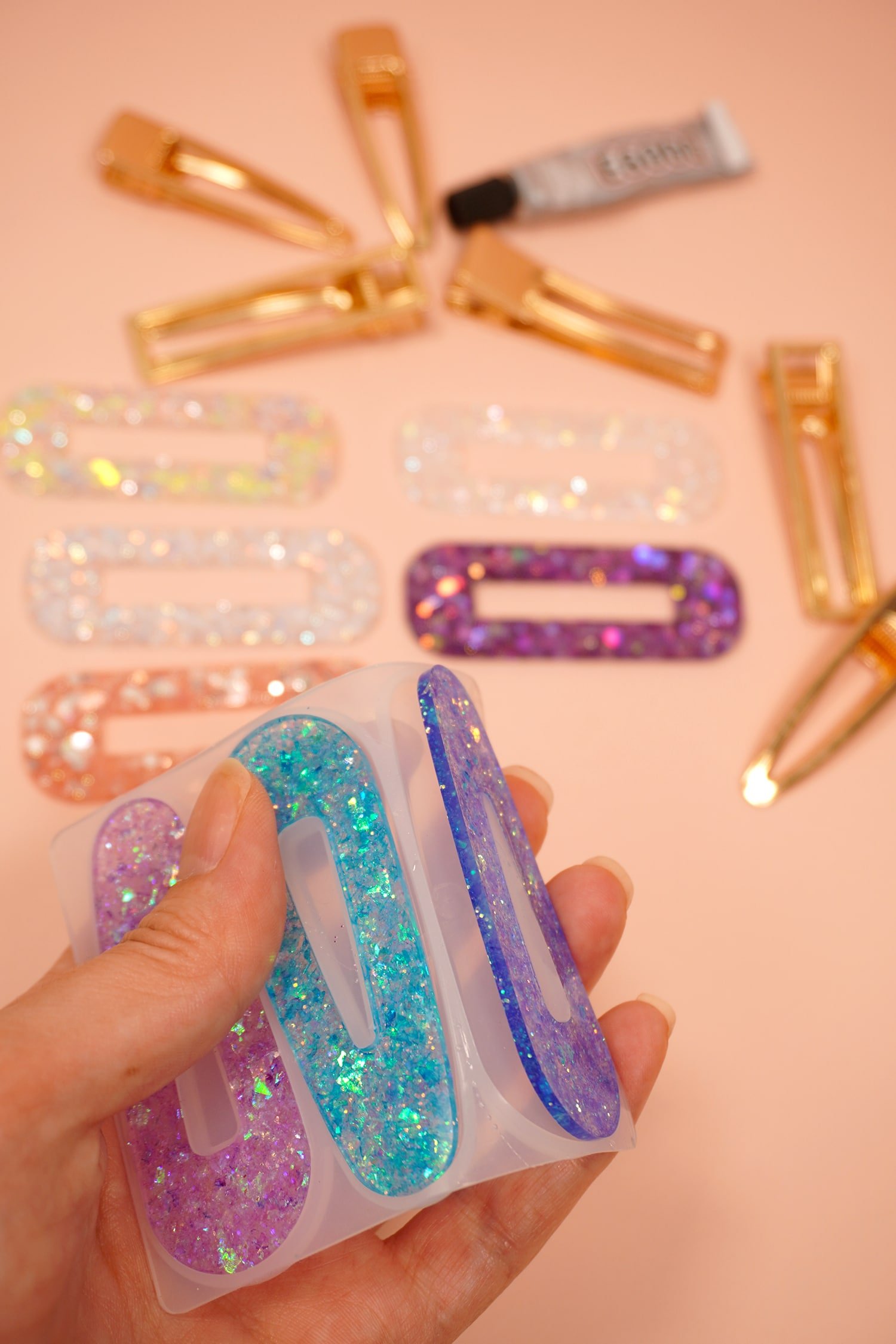 hand popping out finished resin barrettes