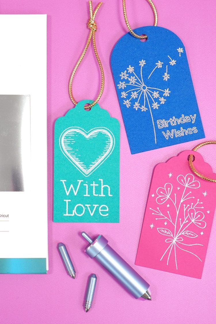 cricut foil transfer system tools tips and gift tags next to cricut tools