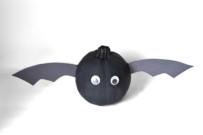 black painted pumpkin with wings to look like bat