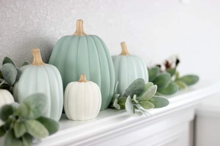 pretty green pumpkins on styled mantel