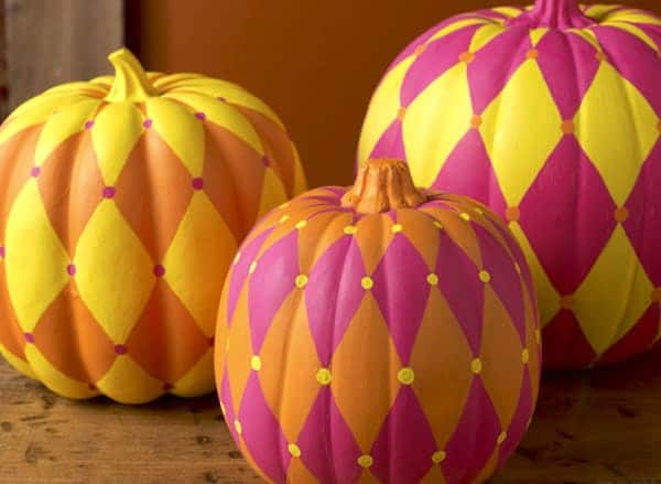 pumpkins painted in harlequin pattern