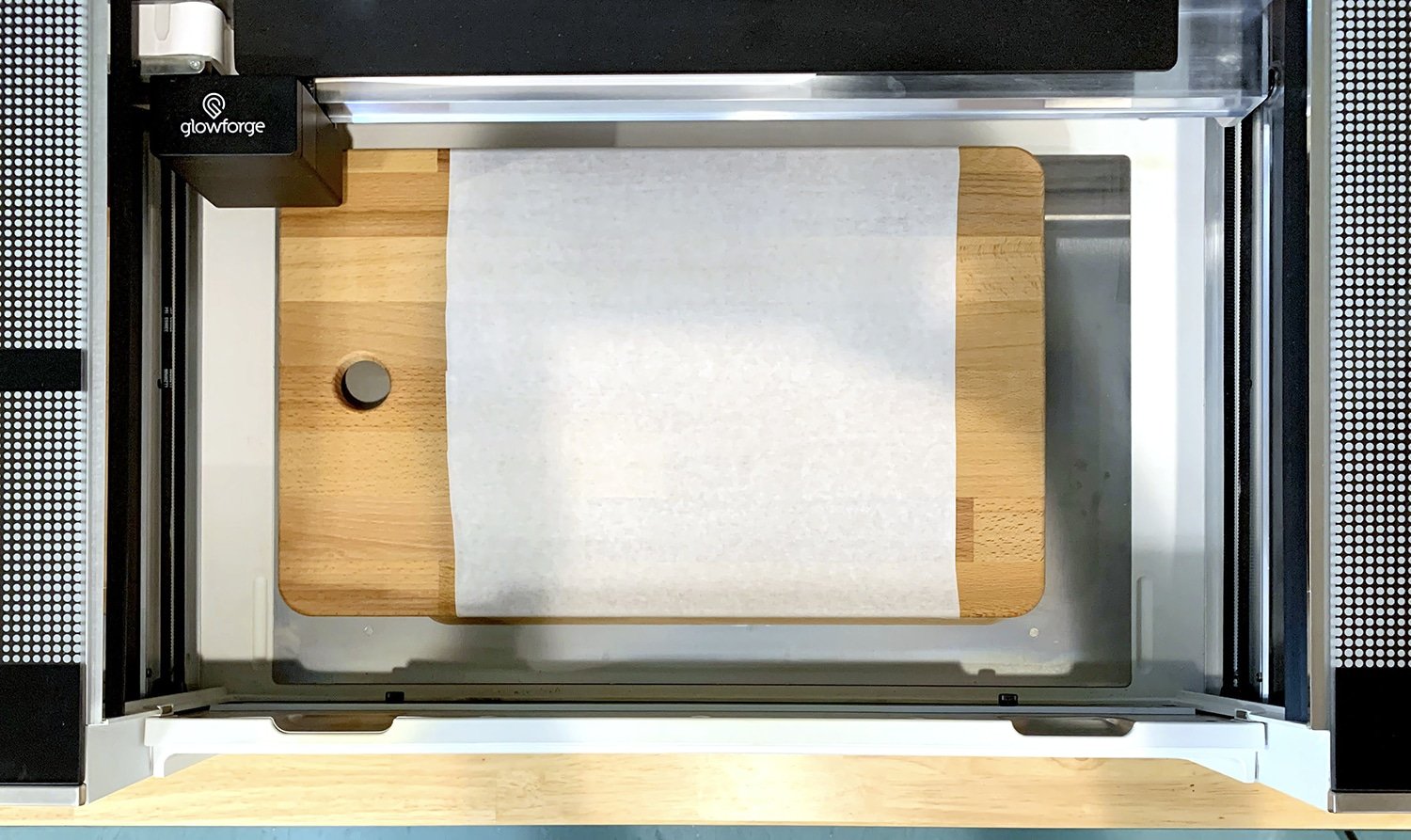 Masked cutting board inside a Glowforge Pro machine