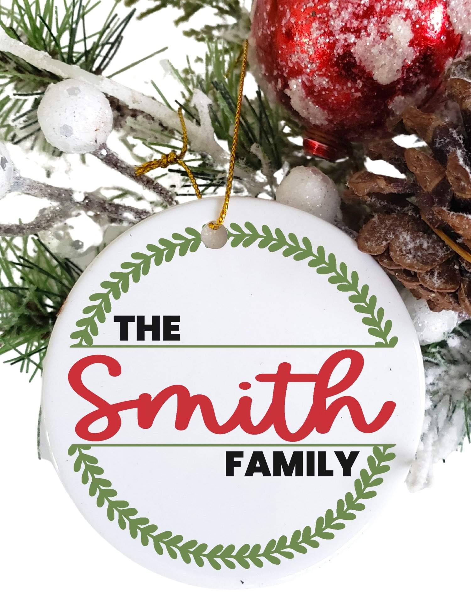 Round white Christmas ornament with "The Smith Family" and wreath design in red and green