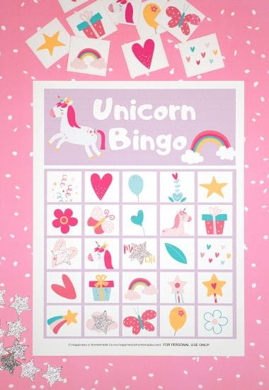 Printable Unicorn Bingo Game Cards on pink background with silver star markers and calling cards