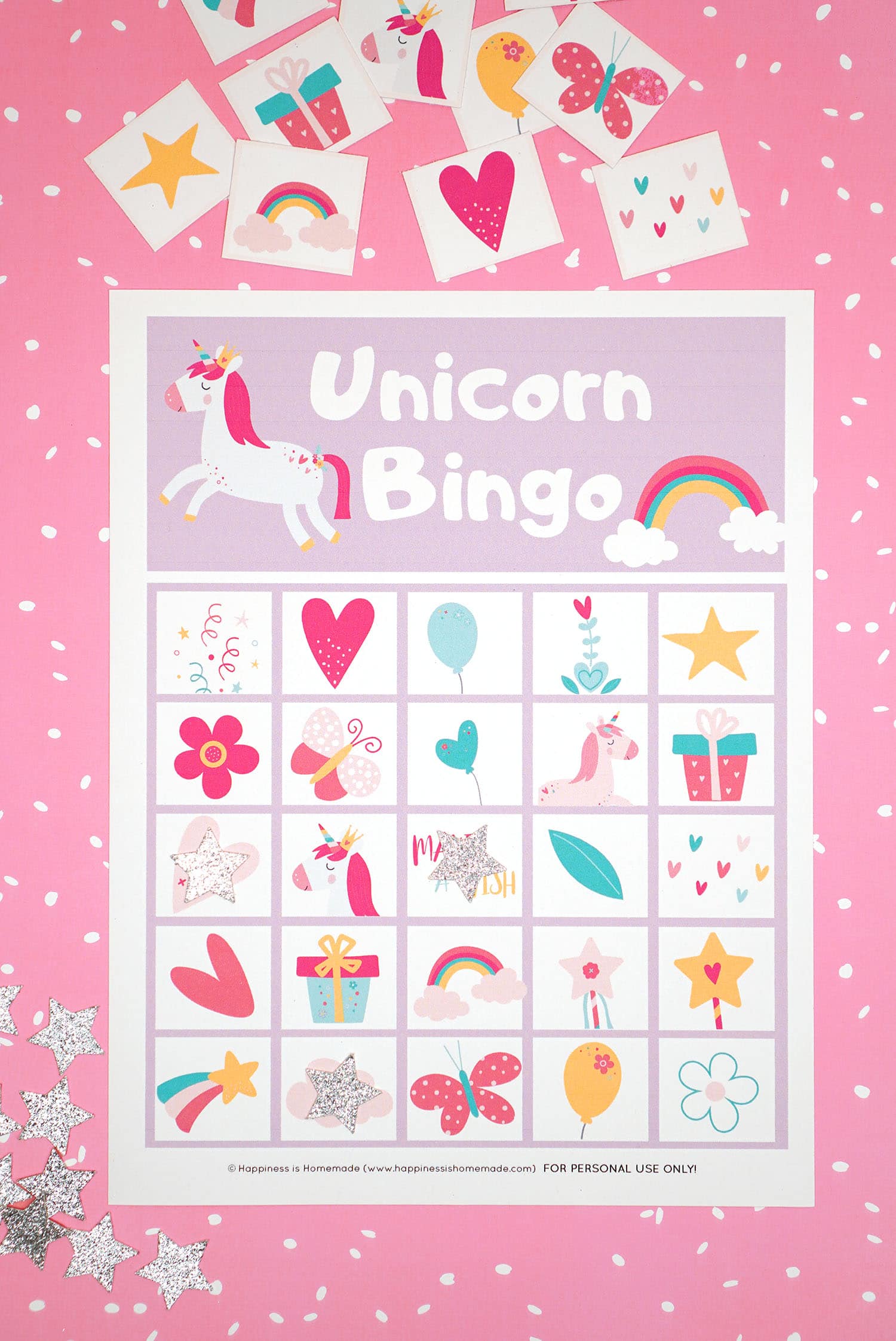 Printable Unicorn Bingo Game Cards on pink background with silver star markers and calling cards