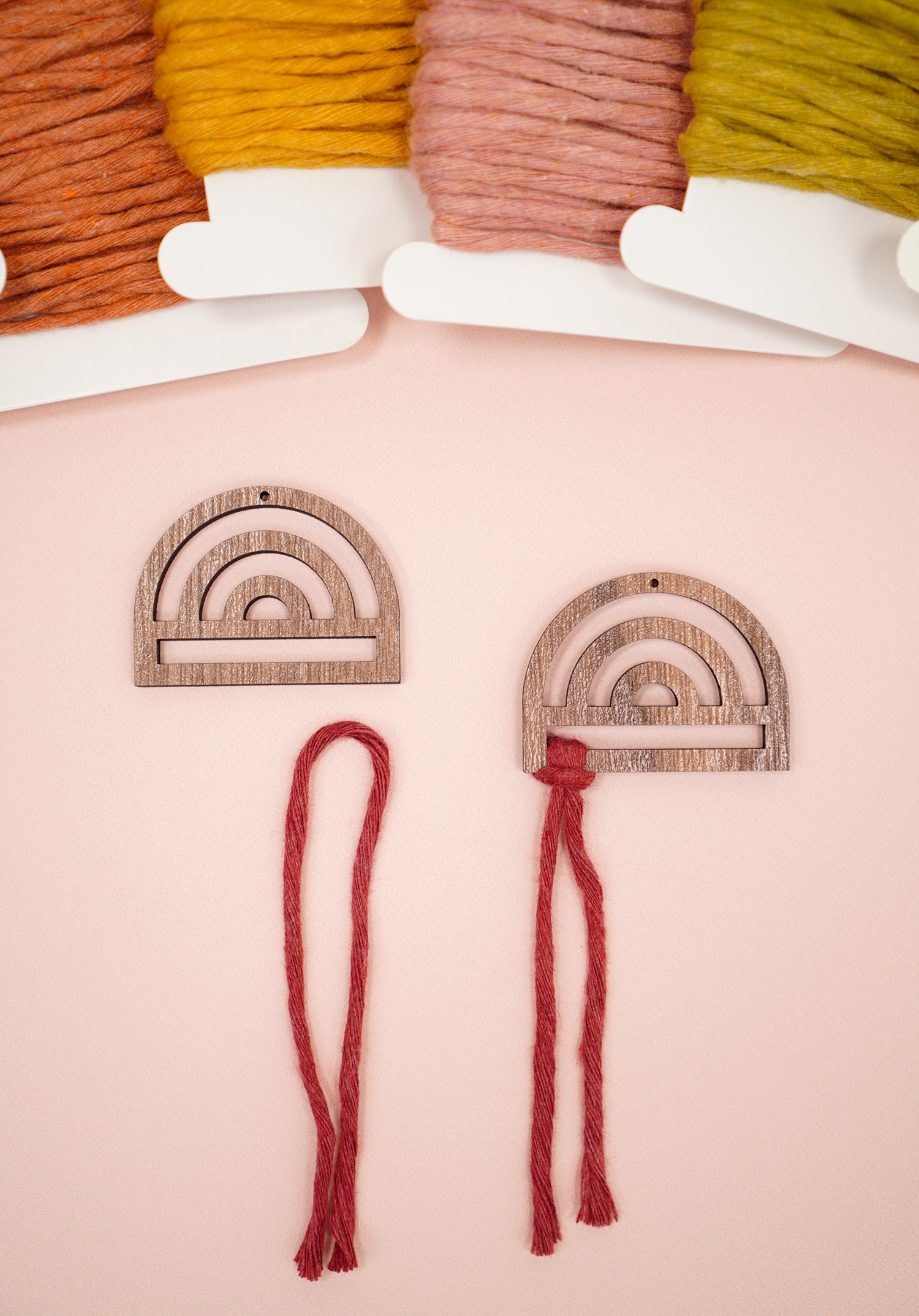 Rainbow Wood Macrame Earring Frames and Cording on peach background