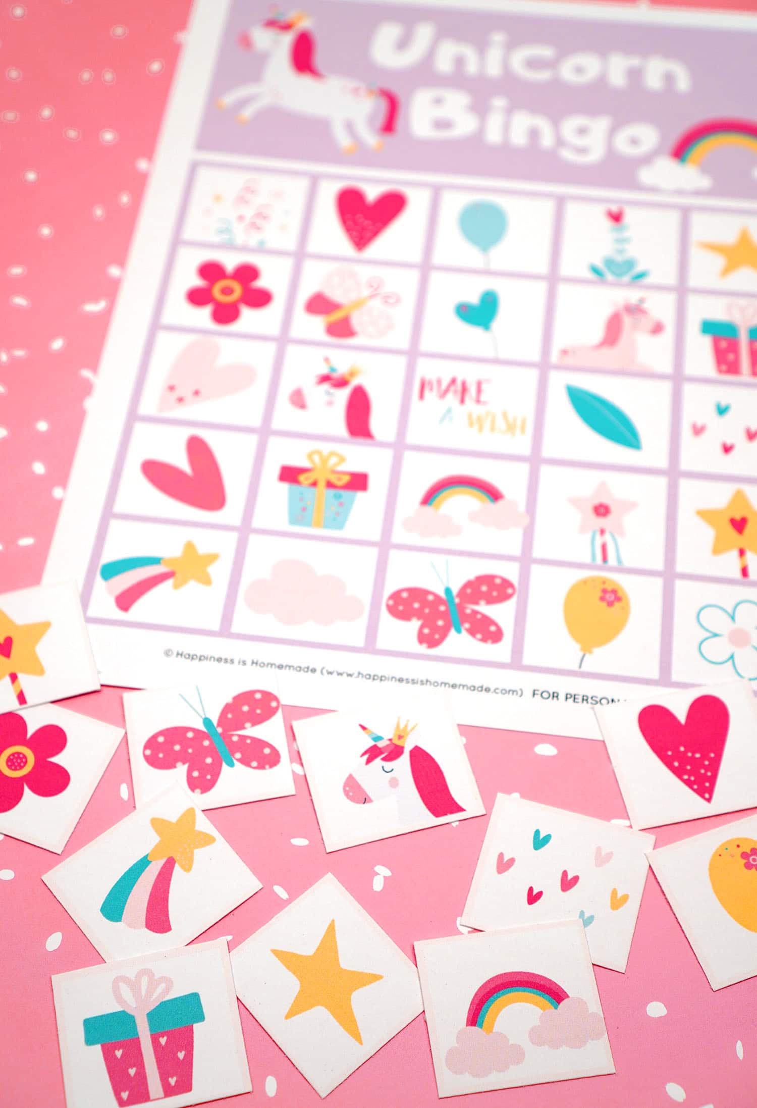 Printable Unicorn Bingo Game Cards and calling cards on pink background with