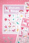 Printable Unicorn Bingo Game Cards on pink background with silver star markers and calling cards