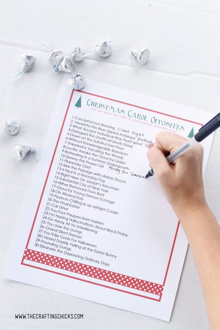 christmas carol opposites printable game being marked off